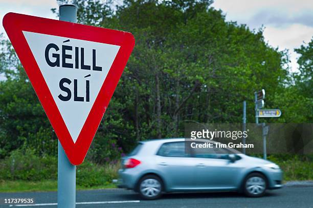 gaelic go slow sign, connemara, ireland - gaels stock pictures, royalty-free photos & images
