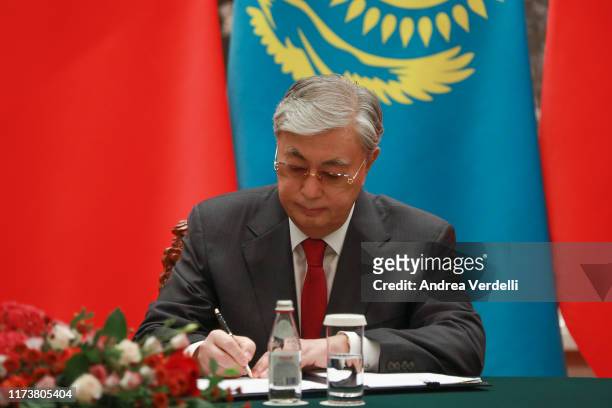 Kazakh President Kassym Jomart Tokayev signs documents during the signing ceremony, part of the meeting with Chinese President Xi Jinping on...