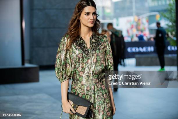 Kriti Sanon is seen wearing golden dress with floral print outside Coach during New York Fashion Week September 2019 on September 10, 2019 in New...