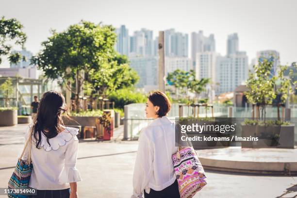two friends taking a walk - korea apartment woman stock-fotos und bilder