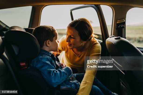 mother and son enjoying - embracing car stock pictures, royalty-free photos & images