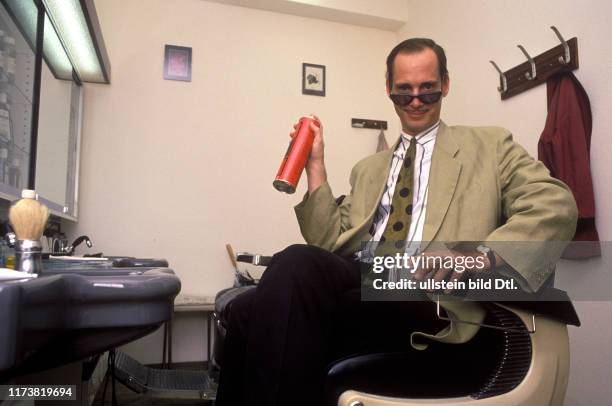 John Waters with hairspray, 1988