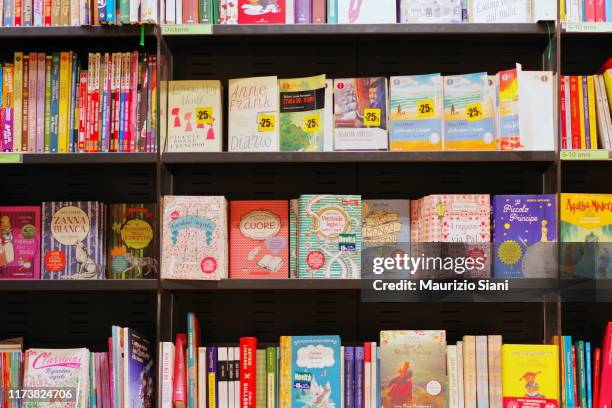 books on shelves in bookstore - children's literature stock pictures, royalty-free photos & images