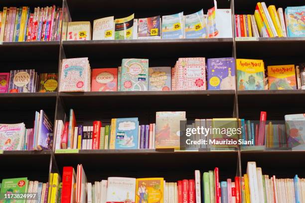 full frame shot of books in shelf - children's literature stock pictures, royalty-free photos & images