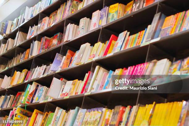 books on shelves in bookstore - children's literature stock pictures, royalty-free photos & images