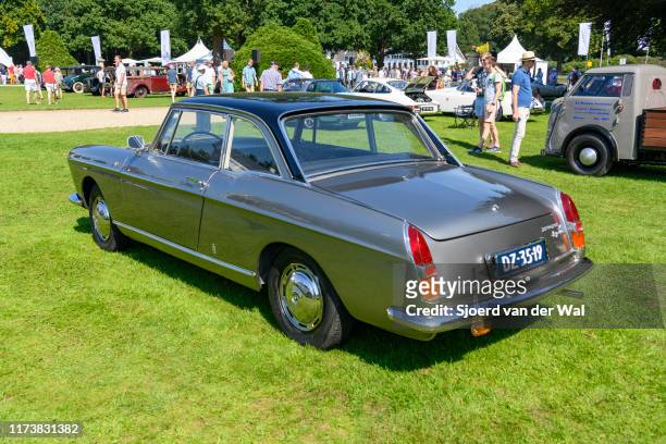 Peugeot 404 Coupé classic French car on display at the 2019 Concours d'Elegance at palace Soestdijk on August 25, 2019 in Baarn, Netherlands. This is...