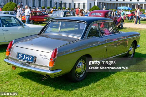 Peugeot 404 Coupé classic French car on display at the 2019 Concours d'Elegance at palace Soestdijk on August 25, 2019 in Baarn, Netherlands. This is...