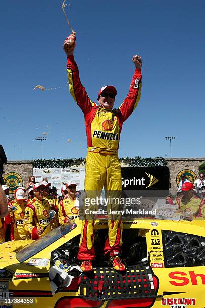 Kurt Busch, driver of the Shell/Pennzoil Dodge, celebrates in victory lane after winning the NASCAR Sprint Cup Series Toyota/Save Mart 350 at...