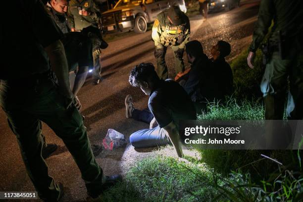 Border Patrol agents detain undocumented immigrants on September 10, 2019 in Mission, Texas. They had crossed the Rio Grande into Texas earlier in...