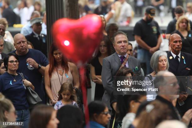 People observe a moment of silence during ceremonies at the National September 11 Memorial on September 11, 2019 in New York City. Throughout the...