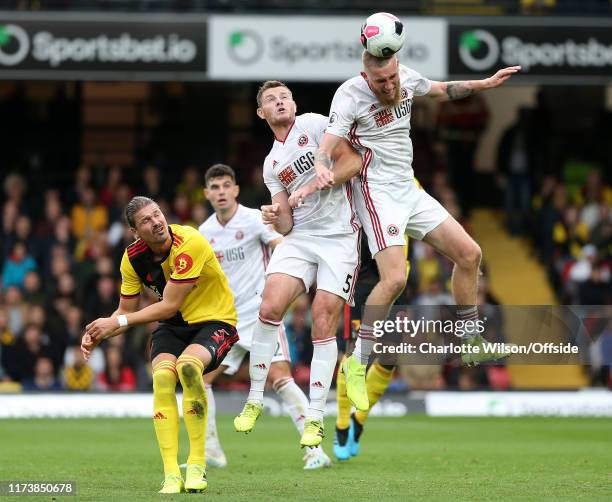 Oli McBurnie of Sheffield United beats Jack O'Connell of Sheffield United and Sebastian Prodl of Watford to the ball during the Premier League match...