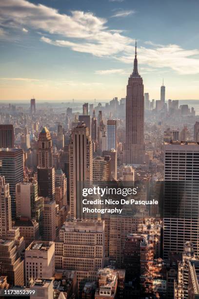 helicopter aerial view of new york city - manhattan stock-fotos und bilder