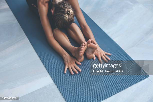 yoga exercises at home - yoga stock pictures, royalty-free photos & images