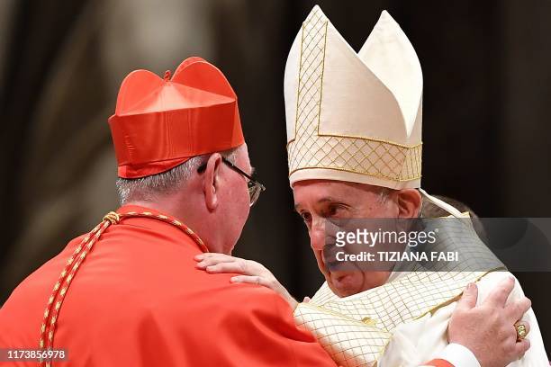 Pope Francis embraces new Cardinal Luxembourgish prelate Jean-Claude Hollerich after he appointed him during an Ordinary Public Consistory for the...
