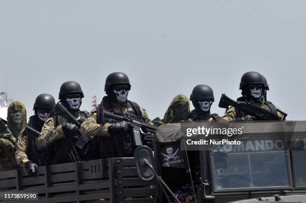Indonesian National Armed Forces soldiers mounted combat vehicles during the 74th celebration parade at Halim Perdanakusuma Air Force Base, Jakarta,...