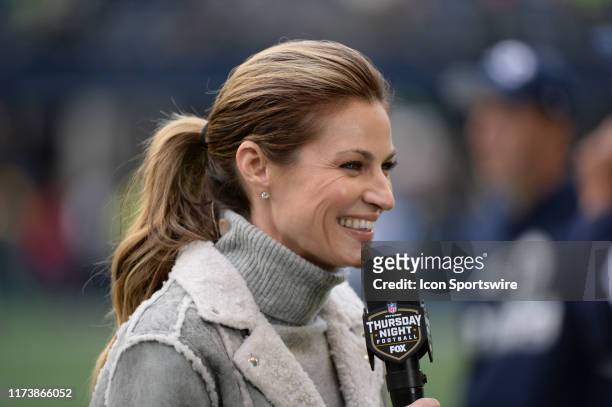 Fox Sports sideline reporter Erin Andrews gives a report before an NFL game between the Los Angeles Rams and the Seattle Seahawks on October 03 at...