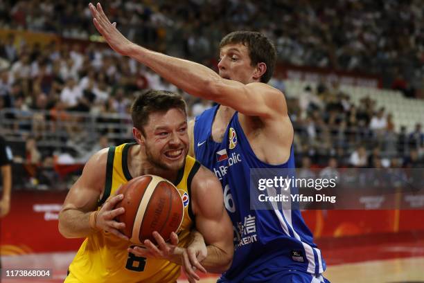 Matthew Dellavedova of Australia tries to make a shot against Pavel Pumprla of Czech Republic during the quarter final match between Australia and...