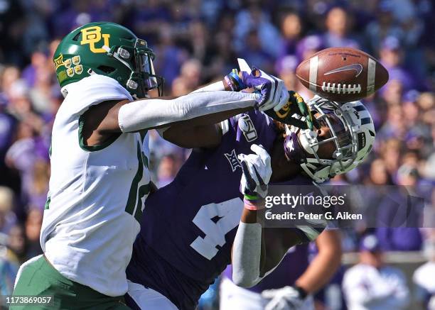 Cornerback Kalon Barnes of the Baylor Bears brakes up a pass intended for wide receiver Malik Knowles of the Kansas State Wildcats during the first...