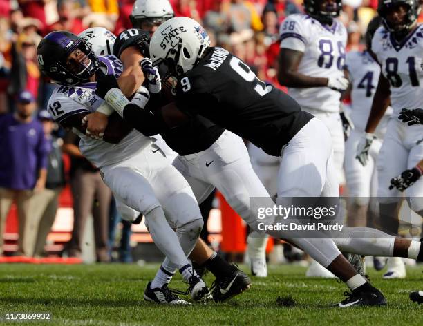 Wide receiver Derius Davis of the TCU Horned Frogs is tackled by linebacker Jared Gescheidler of the Iowa State Cyclones, and linebacker Will...