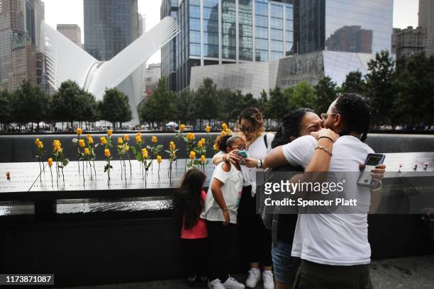 The children of Flowers Elena Ledesma, who was killed on September 11 while working at the World Trade Center as a maintenance coordinator at Marsh &...