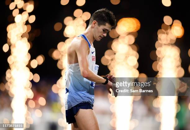 Doha , Qatar - 5 October 2019; Callum Hawkins of Great Britain checks his watch after competing in the Men's Marathon during day nine of the 17th...