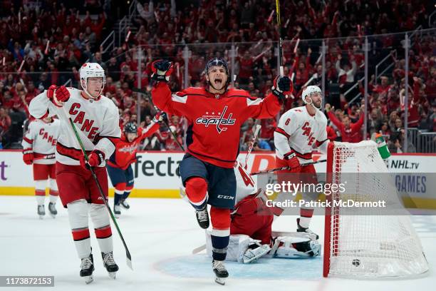 Garnet Hathaway of the Washington Capitals celebrates after scoring a goal against James Reimer of the Carolina Hurricanes in the first period at...