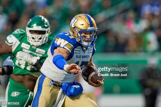 Chris Streveler of the Winnipeg Blue Bombers scrambles with the ball in the first half of the game between the Winnipeg Blue Bombers and Saskatchewan...