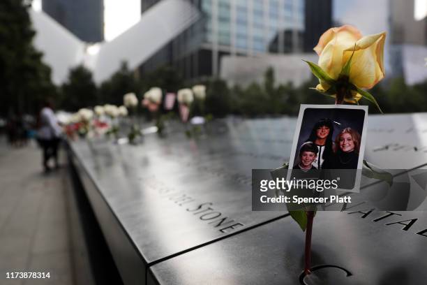 Picture is placed in a name along the National September 11 Memorial during a morning commemoration ceremony for the victims of the terrorist attacks...