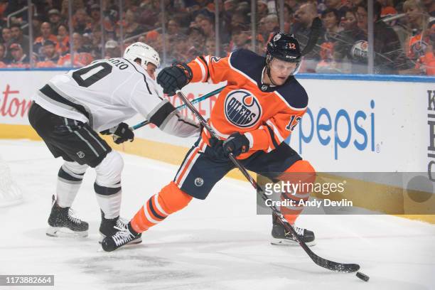 Colby Cave of the Edmonton Oilers battles with Michael Amadio of the Los Angeles Kings on October 5 at Rogers Place in Edmonton, Alberta, Canada.