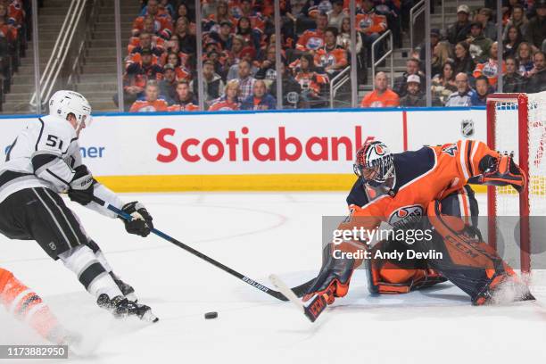 Goaltender Mike Smith of the Edmonton Oilers makes a save against Austin Wagner of the Los Angeles Kings on October 5 at Rogers Place in Edmonton,...