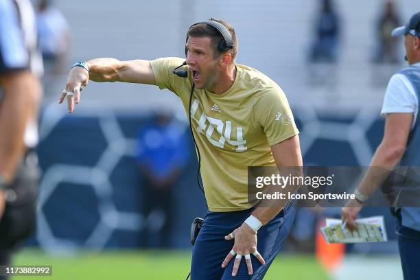 Georgia Tech's defensive coordinator Andrew Thacker signals from the sideline during the NCAA football game between the North Carolina Tar Heels and...