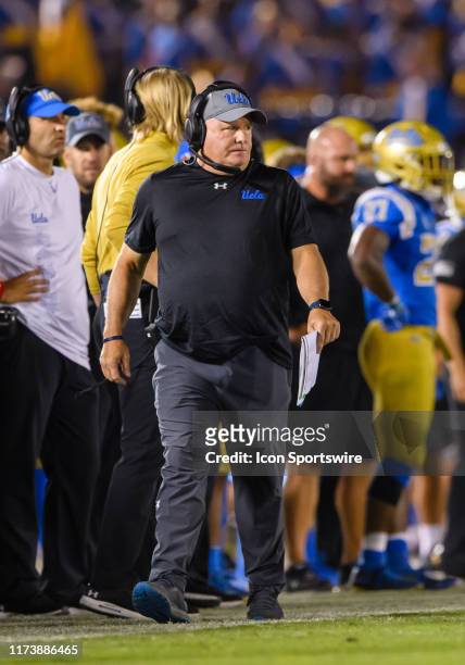 Bruins head coach Chip Kelly walks up the sidelines during a college football game between the Oregon State Beavers and the UCLA Bruins on October 05...