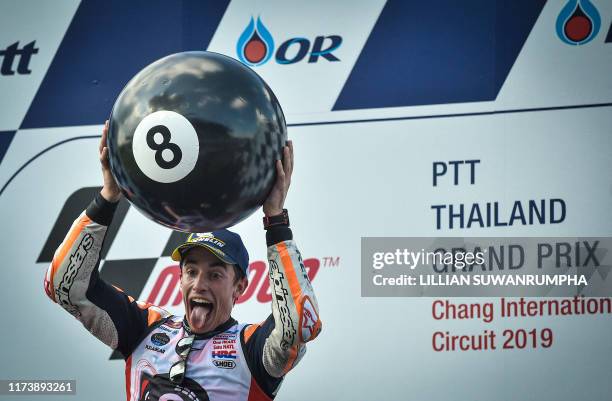 Repsol Honda Team Spanish rider Marc Marquez celebrates on the podium after winning the MotoGP race for the Thailand Grand Prix at Buriram...