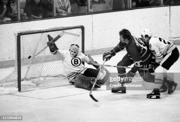 Canadiens' Larry Robinson gets puck by Bruins' goalie Gilles Gilbert for 1st goal of game, 1st Period, game 6, Stanley Cup Semi-Finals, Boston...