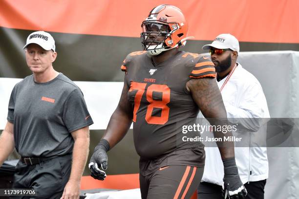 Offensive tackle Greg Robinson of the Cleveland Browns walks off the field after being ejected from the game during the first half against the...