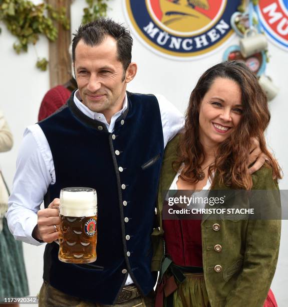 Bayern Munich's Bosnian Sporting director Hasan Salihamidzic and his wife Esther Copado arrive for the football club's annual visit at the...