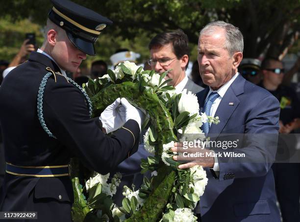 Former U.S. President George W. Bush participates in a wreath-laying ceremony at the 9/11 Pentagon Memorial to commemorate the anniversary of the...