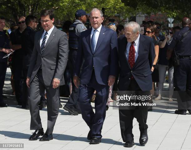 Former U.S. President George W. Bush , U.S. Secretary of Defense Mark Esper and former U.S. Secretary of Defense Donald Rumsfeld participate in a...