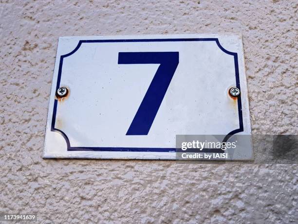 number 7 on house façade, definitely a good luck house address number - house number stock pictures, royalty-free photos & images