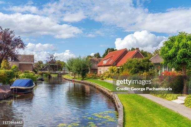 canal in picturesque dutch village - pedestrian walkway stock pictures, royalty-free photos & images