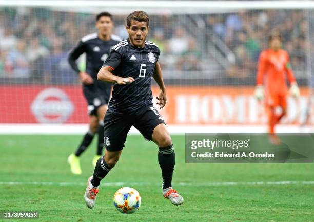 Jonathan Dos Santos of Mexico heads up field against Argentina during their International Friendly soccer match at the Alamodome on September 10,...