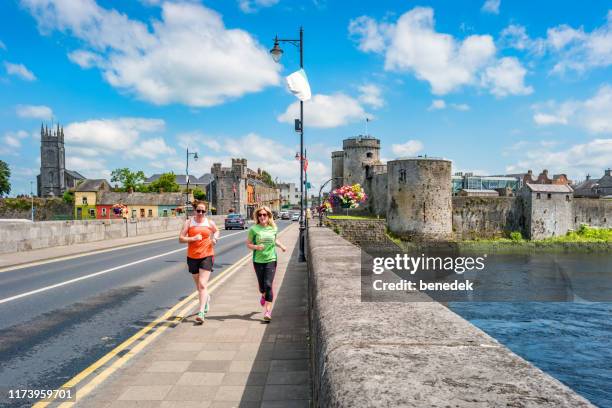 women exercise in old town limerick ireland - county limerick stock pictures, royalty-free photos & images