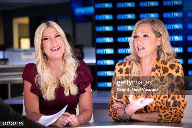 Tori Spelling and Jennie Garth visit "Extra" at Burbank Studios on September 11, 2019 in Burbank, California.