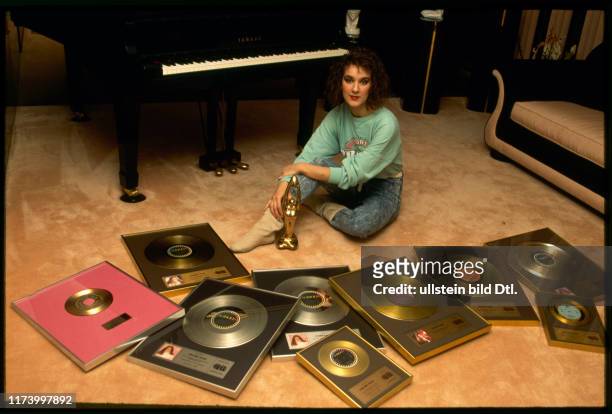 Céline Dion with gold and platin records