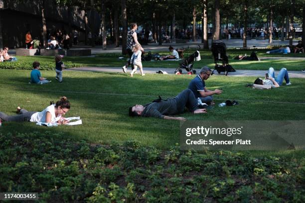 People gather at the National September 11 Memorial following a morning commemoration ceremony for the victims of the terrorist attacks Eighteen...