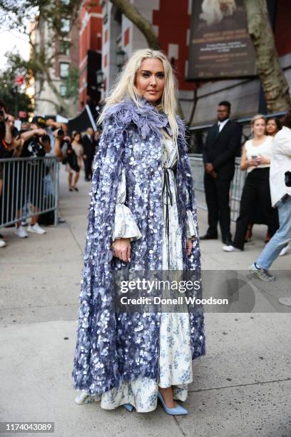Erika Jayne arrives at the Marc Jacobs show during New York Fashion Week wearing a green dress and white handbag on September 11, 2019 in New York...