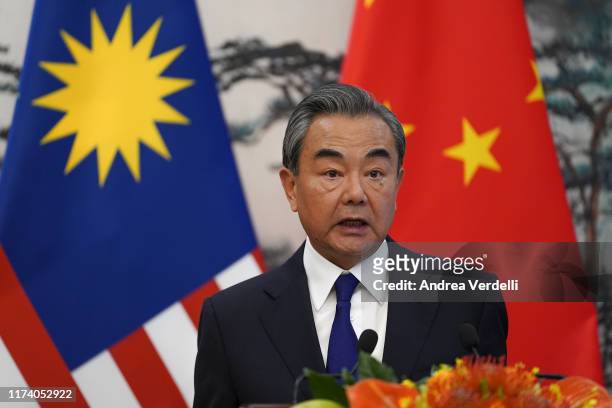 Chinese Foreign Minister Wang Yi speaks during the press conference at the end of the meeting with Malaysian Foreign Minister Dato’ Saifuddin...