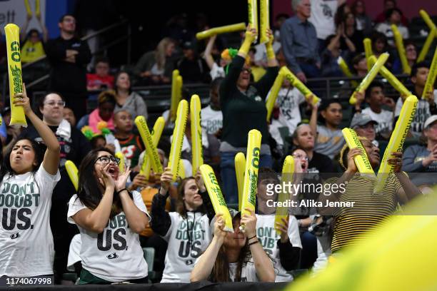 The Seattle Storm fans cheer their team on during the first game of the WNBA playoffs against the Minnesota Lynx at the Angel of the Winds Arena on...