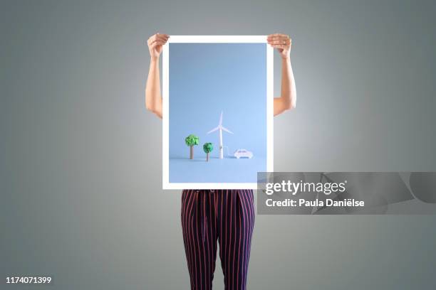 someone holding poster - holding poster stock pictures, royalty-free photos & images