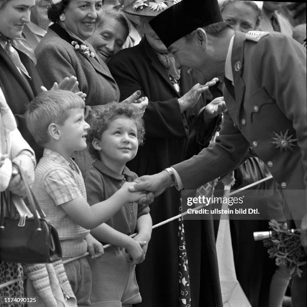 President Sukarno is greeting a Swiss boy, Berne 1956